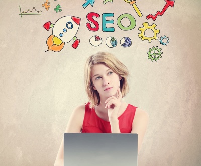 SEO concept with woman working on a laptop